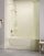 A fiberglass bathtub is the focus of a grey bathroom